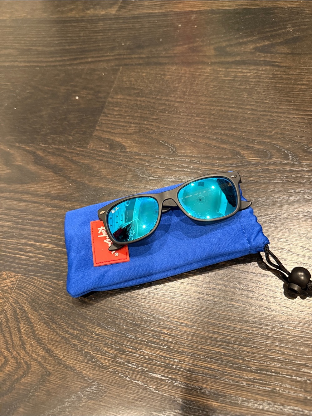 Ray-Ban Matte Black Frame Sunglasses with Blue Mirrored Lenses